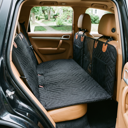 Voyager seat cover fitted across a car back seat forming a flat platform